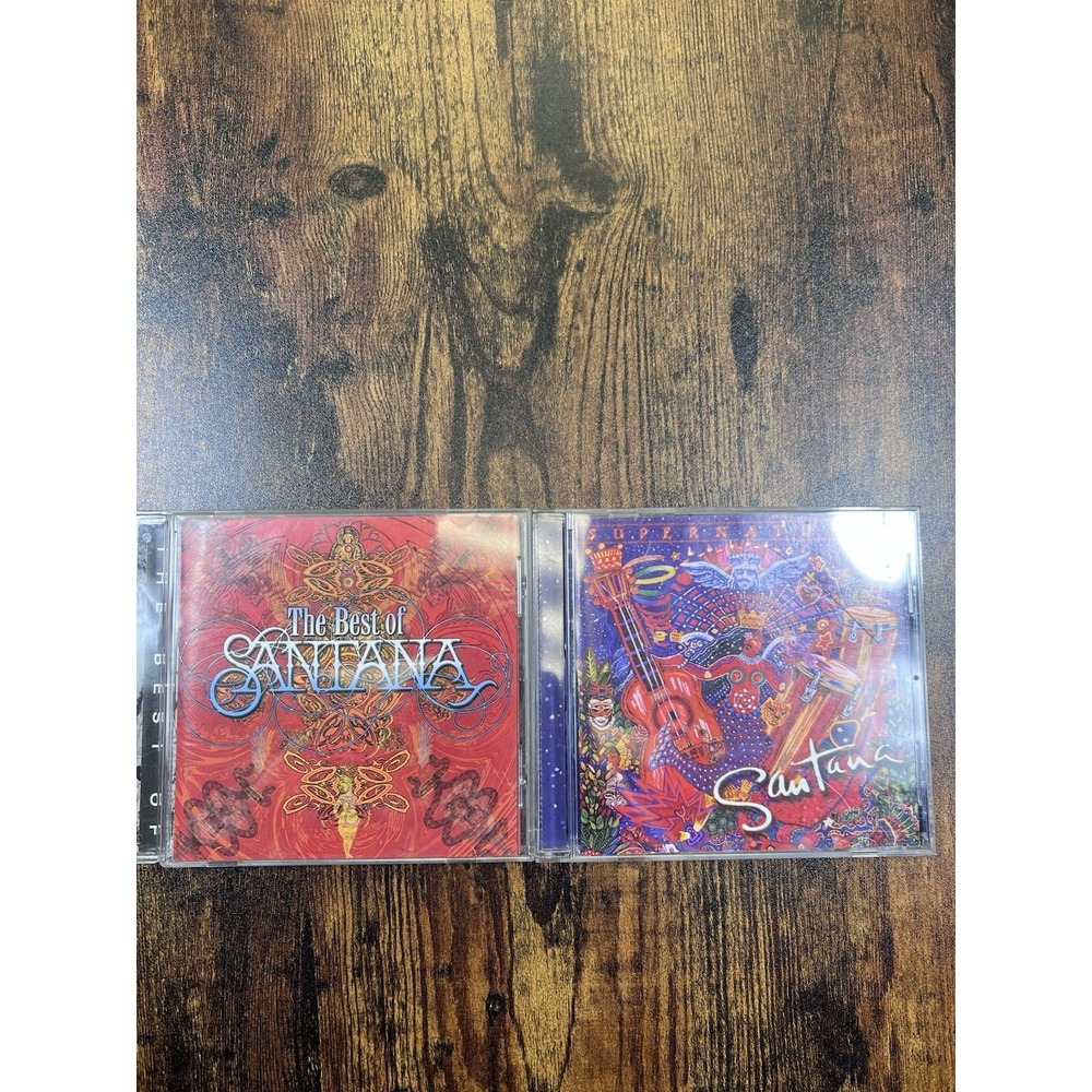 Lot Of 2 Santana CDs The Best Of Santana And Super Natural
